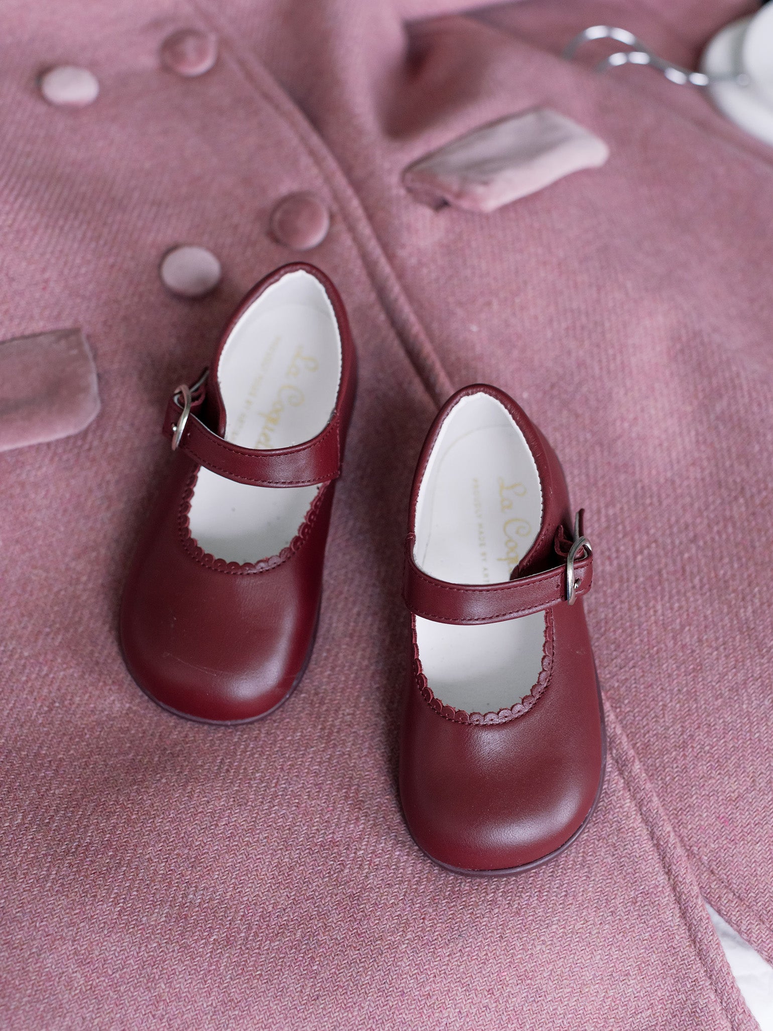 Burgundy girl shops dress shoes